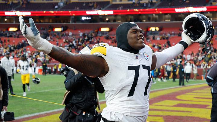 Pittsburgh Steelers offensive tackle Broderick Jones (77) celebrates while leaving the field after the Steelers' game against the Washington Commanders at Northwest Stadium. Mandatory Credit: Geoff Burke-Imagn Images