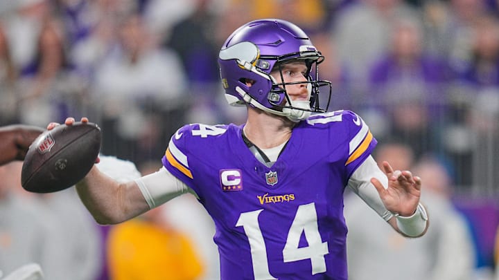 Dec 29, 2024; Minneapolis, Minnesota, USA; Minnesota Vikings quarterback Sam Darnold (14) passes against Green Bay Packers in the second quarter at U.S. Bank Stadium.