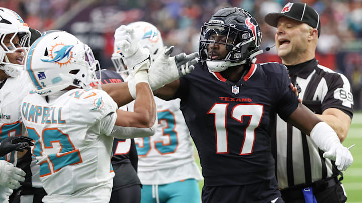 Miami Dolphins safety Elijah Campbell (22) and Houston Texans cornerback Kris Boyd (17) get into a shoving match after the Dolphins recovered a fumble in the third quarter at NRG Stadium. Miami Dolphins safety Elijah Campbell (22) and Houston Texans cornerback Kris Boyd (17) get into a shoving match after the Dolphins recovered a fumble in the third quarter at NRG Stadium.