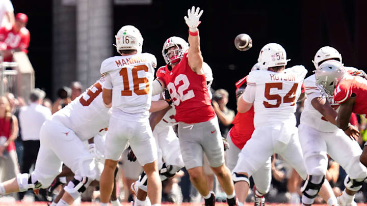 Ohio State Buckeyes defensive end Caden Curry (92) pressures Texas Longhorns quarterback Arch Manning (16) 