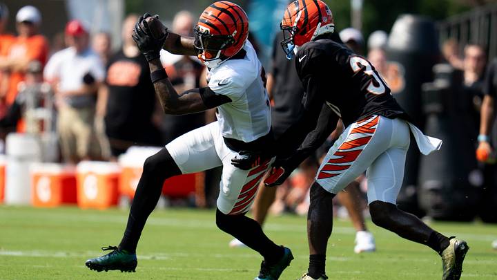 Cincinnati Bengals wide receiver Tee Higgins (5) catches a pass as Cincinnati Bengals cornerback D.J. Ivey (38) defends during Bengals practice at the Kettering Practice Fields in Cincinnati, Ohio, on Thursday, August 6, 2026. Cincinnati Bengals wide receiver Tee Higgins (5) catches a pass as Cincinnati Bengals cornerback D.J. Ivey (38) defends during Bengals practice at the Kettering Practice Fields in Cincinnati, Ohio, on Thursday, August 6, 2026.