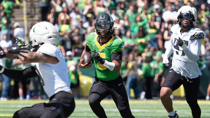 Oregon’s Dante Moore runs for a first down during the first half of the Oregon Spring Game at Autzen Stadium in Eugene April 25, 2026