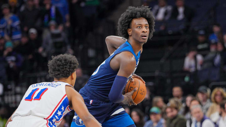 Nov 22, 2023; Minneapolis, Minnesota, USA; Minnesota Timberwolves forward Leonard Miller (33) looks to pass against the Philadelphia 76ers guard Jaden Springer (11) in the fourth quarter at Target Center. Mandatory Credit: Brad Rempel-USA TODAY Sports