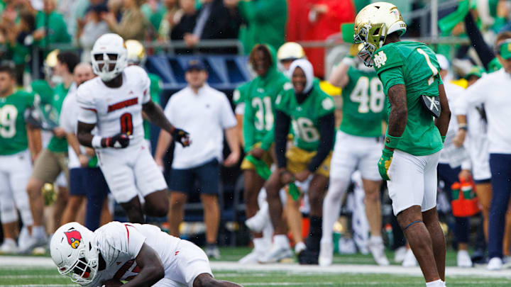 Notre Dame safety Jordan Clark, right, stares down Louisville running back Isaac Brown (25) after tackling him during a NCAA college football game between Notre Dame and Louisville at Notre Dame Stadium on Saturday, Sept. 28, 2024, in South Bend. Notre Dame safety Jordan Clark, right, stares down Louisville running back Isaac Brown (25) after tackling him during a NCAA college football game between Notre Dame and Louisville at Notre Dame Stadium on Saturday, Sept. 28, 2024, in South Bend.