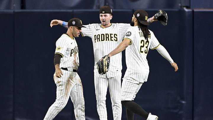 Sep 11, 2025; San Diego, California, USA; San Diego Padres right fielder Ramon Laureano (5), left, Jackson Merrill (3), center, and  Fernando Tatis Jr. (23) celebrate after the Padres defeated the Colorado Rockies at Petco Park. Mandatory Credit: Denis Poroy-Imagn Images