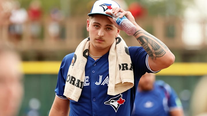 Mar 21, 2024; Bradenton, Florida, USA; Toronto Blue Jays pitcher Ricky Tiedemann (70) walks to the dugout before the game against the Pittsburgh Pirates at LECOM Park. Mandatory Credit: Kim Klement Neitzel-Imagn Images Mar 21, 2024; Bradenton, Florida, USA; Toronto Blue Jays pitcher Ricky Tiedemann (70) walks to the dugout before the game against the Pittsburgh Pirates at LECOM Park. Mandatory Credit: Kim Klement Neitzel-Imagn Images