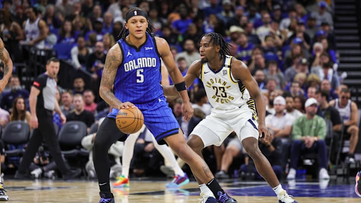 Indiana Pacers forward Aaron Nesmith (23) defends Orlando Magic forward Paolo Banchero (5) during the second half at KIA Center. Indiana Pacers forward Aaron Nesmith (23) defends Orlando Magic forward Paolo Banchero (5) during the second half at KIA Center.