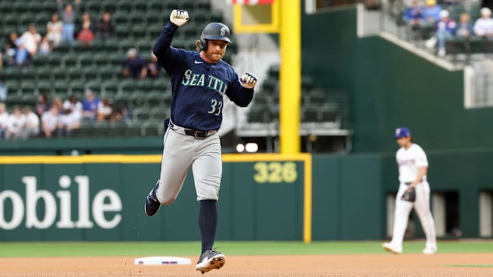 Brendan Donovan (33) reacts after hitting a home run during the first inning against the Texas Rangers at Globe Life Field.