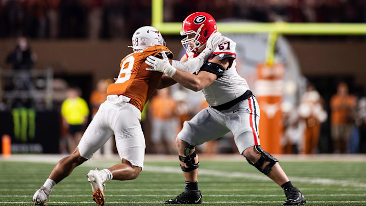 Georgia Bulldogs offensive lineman Monroe Freeling (57) blocks Texas Longhorns edge rusher Trey Moore