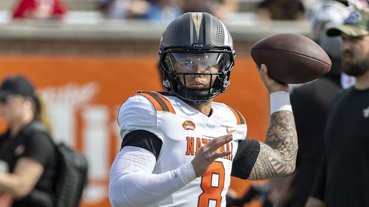 Feb 1, 2025; Mobile, AL, USA; National team quarterback Dillon Gabriel of Oregon (8) warms up before the 2025 Senior Bowl football game against the American Team at Hancock Whitney Stadium. Mandatory Credit: Vasha Hunt-Imagn Images