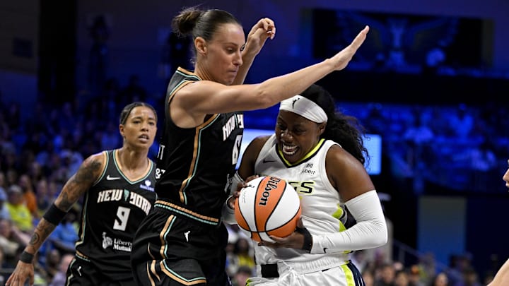 Jul 28, 2025; Arlington, Texas, USA; Dallas Wings guard Arike Ogunbowale (24) drives to the basket against New York Liberty forward Stephanie Talbot (6) during the first half at College Park Center. Mandatory Credit: Jerome Miron-Imagn Images