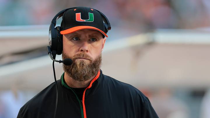 Nov 15, 2025; Miami Gardens, Florida, USA; against the Miami Hurricanes defensive coordinator Corey Hetherman watches from the sideline before the game against NC State Wolfpack at Hard Rock Stadium. Mandatory Credit: Sam Navarro-Imagn Images Nov 15, 2025; Miami Gardens, Florida, USA; against the Miami Hurricanes defensive coordinator Corey Hetherman watches from the sideline before the game against NC State Wolfpack at Hard Rock Stadium. Mandatory Credit: Sam Navarro-Imagn Images