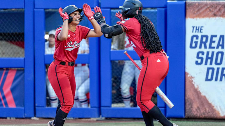 Texas Tech infielder Lauren Allred (11) scores in the fourth inning during game 3 between Texas Tech and Ole Miss at the Women’s College World Series at Devon Park in Oklahoma City, on Thursday, May 29, 2025.