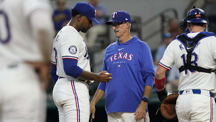 Sep 19, 2024; Arlington, Texas, USA; Texas Rangers pitcher Kumar Rocker (80) is visited on the mound by pitching coach Mike Maddox (41) during the second inning against the Toronto Blue Jays at Globe Life Field. Mandatory Credit: Raymond Carlin III-Imagn Images