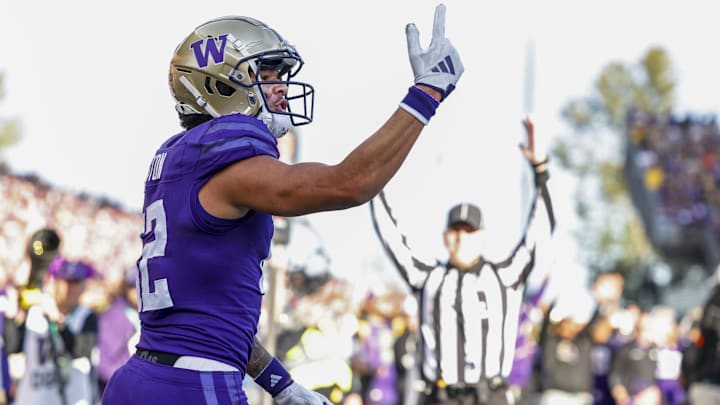Washington Huskies wide receiver Denzel Boston celebrates after catching a touchdown pass against the Michigan Wolverines.