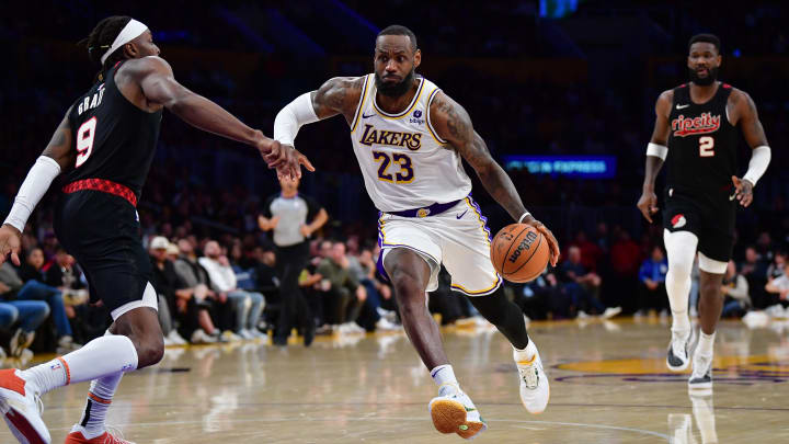 Jan 21, 2024; Los Angeles, California, USA; Los Angeles Lakers forward LeBron James (23) moves the ball against Portland Trail Blazers forward Jerami Grant (9) during the second half at Crypto.com Arena. Mandatory Credit: Gary A. Vasquez-USA TODAY Sports
