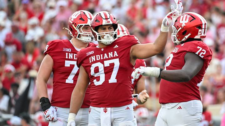 Sep 19, 2026; Bloomington, Indiana, USA; Indiana Hoosiers defensive lineman Mario Landino (97) celebrates with Indiana Hoosiers offensive lineman Adedamola Ajani (72) after a play against the Western Kentucky Hilltoppers during the second half at Merchants Bank Field at Memorial Stadium. Mandatory Credit: Robert Goddin-Imagn Images