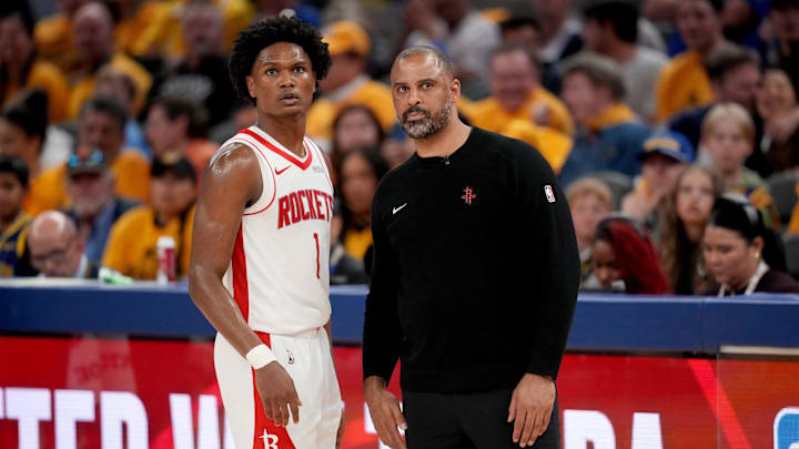 May 2, 2025; San Francisco, California, USA; Houston Rockets forward Amen Thompson (1) meets with Houston Rockets head coach Ime Udoka during a break in the action against the Golden State Warriors in the fourth quarter of game six of the first round for the 2025 NBA Playoffs at Chase Center. Mandatory Credit: Cary Edmondson-Imagn Images