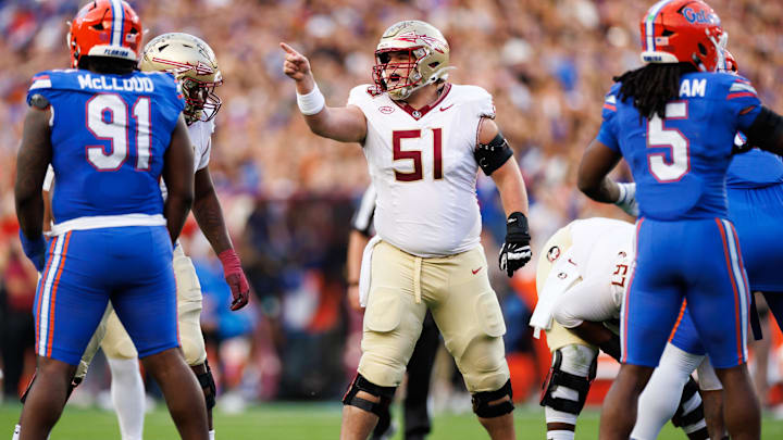 Nov 29, 2025; Gainesville, Florida, USA; Florida State Seminoles offensive lineman Luke Petitbon (51) gestures before the snap against the Florida Gators during the first half at Ben Hill Griffin Stadium. Mandatory Credit: Matt Pendleton-Imagn Images
