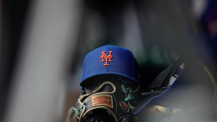 Aug 8, 2024; Denver, Colorado, USA; A New York Mets hat and glove in the dugout in the second inning against the Colorado Rockies at Coors Field. Mandatory Credit: Isaiah J. Downing-Imagn Images Aug 8, 2024; Denver, Colorado, USA; A New York Mets hat and glove in the dugout in the second inning against the Colorado Rockies at Coors Field. Mandatory Credit: Isaiah J. Downing-Imagn Images