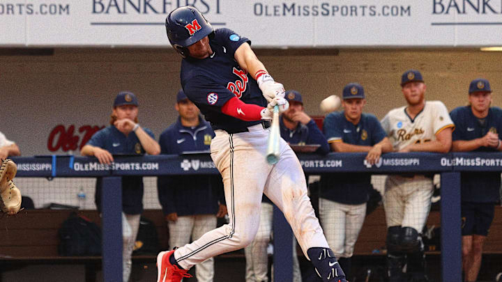 Jun 1, 2025; Oxford, MS, USA; Mississippi Rebels catcher Austin Fawley (24) hits a home run during the second inning against the Murray State Racers. Mandatory Credit: Petre Thomas-Imagn Images