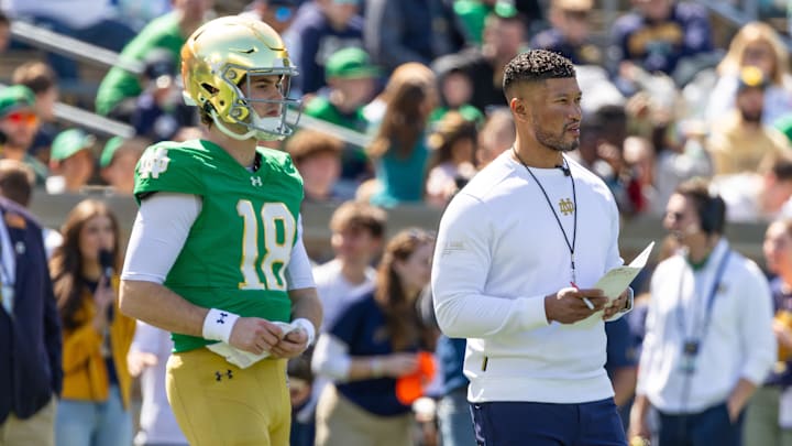 Apr 12, 2025; Notre Dame, IN, USA; Notre Dame Fighting Irish quarterback Steve Angeli (18) watches alongside head coach Marcus Freeman during the Blue-Gold game at Notre Dame Stadium. 