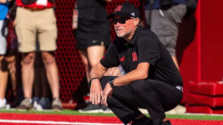 Sep 13, 2025; Lincoln, Nebraska, USA; Nebraska Cornhuskers assistant coach Dana Holgorsen watches during warmups before the game against the Houston Christian Huskies at Memorial Stadium. Mandatory Credit: Dylan Widger-Imagn Images