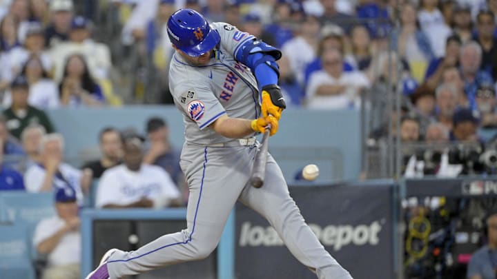 Oct 20, 2024; Los Angeles, California, USA; New York Mets first baseman Pete Alonso (20) hits a single in the third inning against the Los Angeles Dodgers during game six of the NLCS for the 2024 MLB playoffs at Dodger Stadium. Oct 20, 2024; Los Angeles, California, USA; New York Mets first baseman Pete Alonso (20) hits a single in the third inning against the Los Angeles Dodgers during game six of the NLCS for the 2024 MLB playoffs at Dodger Stadium.