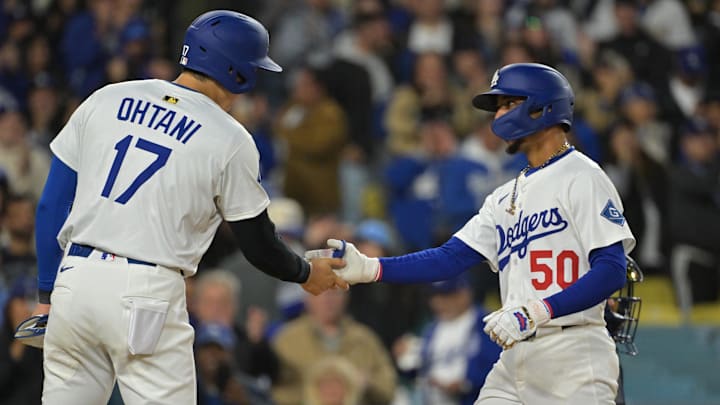 Apr 1, 2025; Los Angeles, California, USA; Los Angeles Dodgers shortstop Mookie Betts (50) shakes hands with designated hitter Shohei Ohtani (17) after hitting a two run home run in the sixth inning against the Atlanta Braves at Dodger Stadium. Mandatory Credit: Jayne Kamin-Oncea-Imagn Images Apr 1, 2025; Los Angeles, California, USA; Los Angeles Dodgers shortstop Mookie Betts (50) shakes hands with designated hitter Shohei Ohtani (17) after hitting a two run home run in the sixth inning against the Atlanta Braves at Dodger Stadium. Mandatory Credit: Jayne Kamin-Oncea-Imagn Images