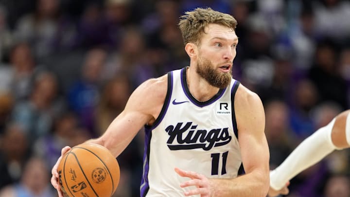 Dec 30, 2024; Sacramento, California, USA; Sacramento Kings forward Domantas Sabonis (11) dribbles against the Dallas Mavericks during the third quarter at Golden 1 Center. Mandatory Credit: Darren Yamashita-Imagn Images