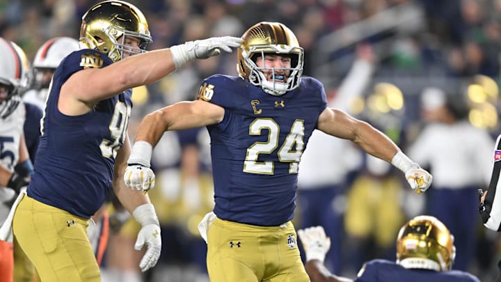 Nov 16, 2024; South Bend, Indiana, USA; Notre Dame Fighting Irish linebacker Jack Kiser (24) celebrates after a sack against the Virginia Cavaliers in the fourth quarter at Notre Dame Stadium. Mandatory Credit: Matt Cashore-Imagn Images