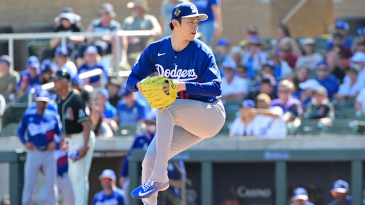 Feb 25, 2026; Salt River Pima-Maricopa, Arizona, USA; Los Angeles Dodgers pitcher Roki Sasaki (11) throws in the first inning against the Arizona Diamondbacks at Salt River Fields at Talking Stick. Mandatory Credit: Matt Kartozian-Imagn Images