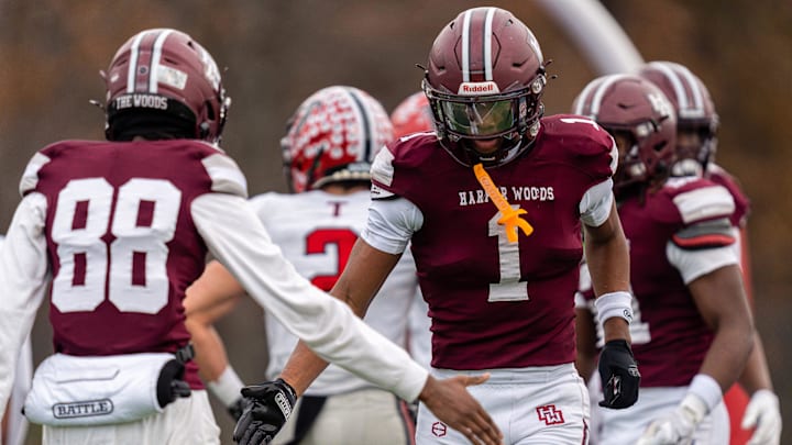 Harper Woods wide receiver Dakota Guerrant (1) celebrates with his teammate after scoring a touchdown during a Division 4 regional final against Divine Child High School at John Glenn High School in Westland on Saturday, Nov. 15, 2025. Harper Woods wide receiver Dakota Guerrant (1) celebrates with his teammate after scoring a touchdown during a Division 4 regional final against Divine Child High School at John Glenn High School in Westland on Saturday, Nov. 15, 2025.