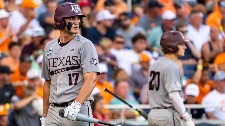 Jun 24, 2024: Texas A&M Aggies right fielder Jace Laviolette (17) walks off as catcher Jackson Appel (20) walks up to bat during the sixth inning against the Tennessee Volunteers at Charles Schwab Field Omaha. 