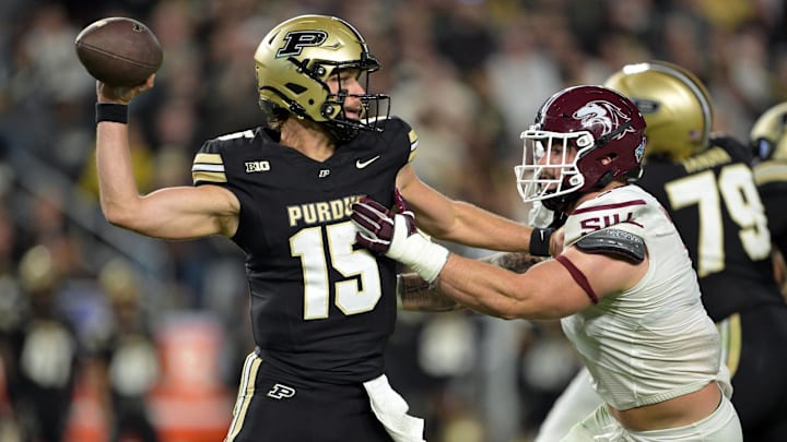Purdue Boilermakers quarterback Ryan Browne (15) throws the ball