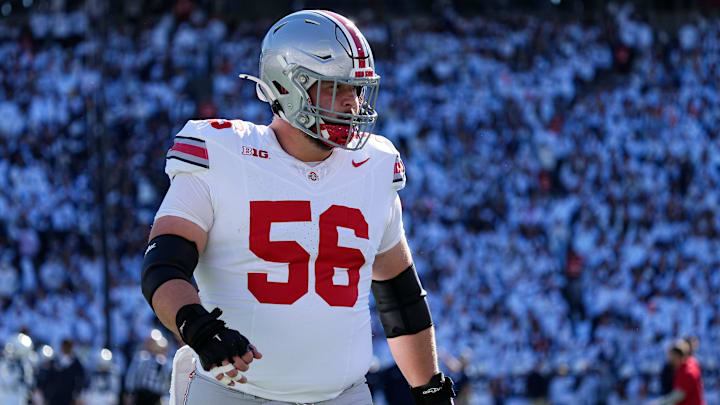 Ohio State Buckeyes offensive lineman Seth McLaughlin (56) warms up during the NCAA football game against the Penn State Nittany Lions at Beaver Stadium in University Park, Pa. on Monday, Nov. 4, 2024. Ohio State won 20-13. Ohio State Buckeyes offensive lineman Seth McLaughlin (56) warms up during the NCAA football game against the Penn State Nittany Lions at Beaver Stadium in University Park, Pa. on Monday, Nov. 4, 2024. Ohio State won 20-13.