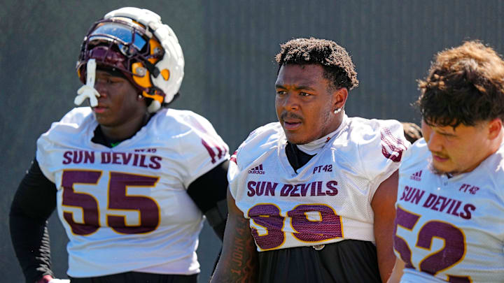 Arizona State defensive linemen Ramar Williams (55), CJ Fite (99) and Manamo’ui Muti (52) take a breath during the first day of fall practice in Tempe, Ariz. on July 30, 2025. Arizona State defensive linemen Ramar Williams (55), CJ Fite (99) and Manamo’ui Muti (52) take a breath during the first day of fall practice in Tempe, Ariz. on July 30, 2025.