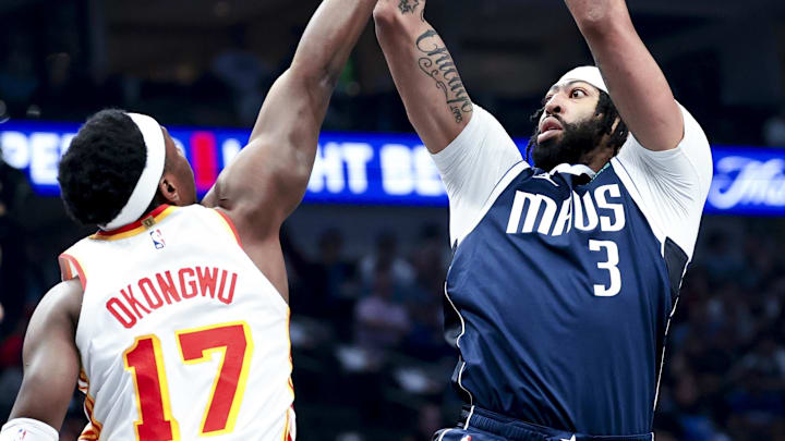 Apr 2, 2025; Dallas, Texas, USA;  Dallas Mavericks forward Anthony Davis (3) shoots over Atlanta Hawks forward Onyeka Okongwu (17) during the first quarter at American Airlines Center. Mandatory Credit: Kevin Jairaj-Imagn Images