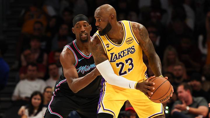 Mar 19, 2026; Miami, Florida, USA; Miami Heat center Bam Adebayo (13) defends Los Angeles Lakers forward LeBron James (23) during second half at Kaseya Center. Mandatory Credit: Isabella Frias-Imagn Images