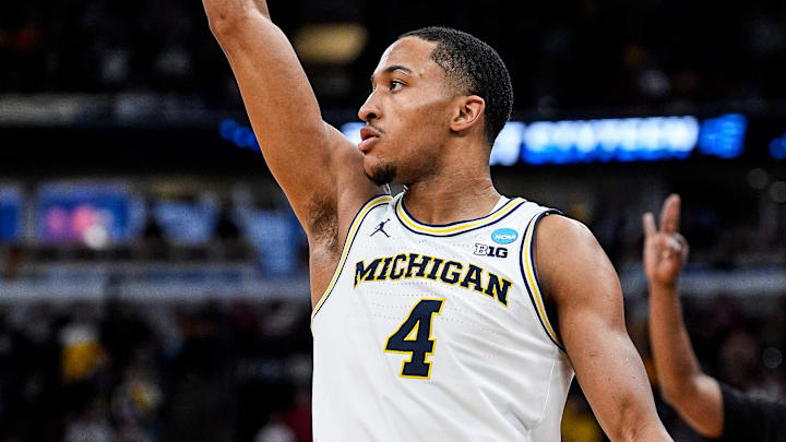 Michigan guard Nimari Burnett (4) attempts a 3-pointer against Alabama during the second half of NCAA Tournament Sweet 16 round at United Center in Chicago on Friday, March 27, 2026.