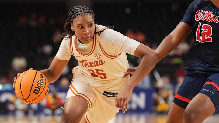 Mar 7, 2026; Greenville, SC, USA; Texas Longhorns forward Madison Booker (35) goes to the basket against Mississippi Rebels forward Christeen Iwuala (12)during the second half  at Bon Secours Wellness Arena. Mandatory Credit: Jim Dedmon-Imagn Images
