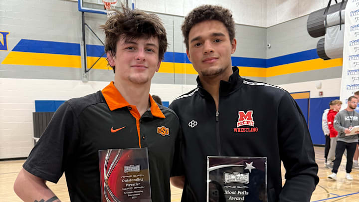 In his final event as a high school wrestler, Jax Forrest (left) won his fourth PowerAde crown. Bishop McCort teammate Melvin Miller (160) also won at PowerAde. 