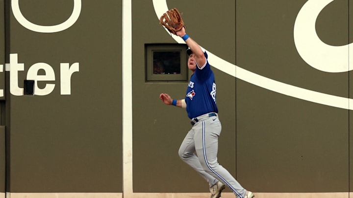 Toronto Blue Jays outfielder Alan Roden (87) catches a fly ball against the Boston Red Sox at JetBlue Park at Fenway South in 2024.