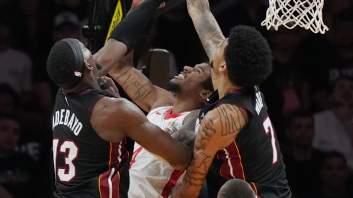Mar 21, 2025; Miami, Florida, USA; Miami Heat center Kel'el Ware (7) blocks the shot of Houston Rockets guard Jalen Green (4) as center Bam Adebayo (13) closes in during the second half at Kaseya Center. Mandatory Credit: Jim Rassol-Imagn Images Mar 21, 2025; Miami, Florida, USA; Miami Heat center Kel'el Ware (7) blocks the shot of Houston Rockets guard Jalen Green (4) as center Bam Adebayo (13) closes in during the second half at Kaseya Center. Mandatory Credit: Jim Rassol-Imagn Images