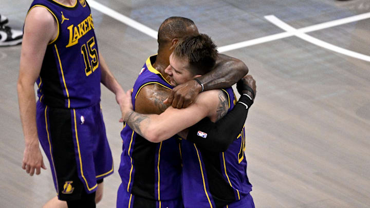 Apr 9, 2025; Dallas, Texas, USA: Los Angeles Lakers guard Luka Doncic (77) and forward LeBron James (23) celebrate during the fourth quarter against the Dallas Mavericks at the American Airlines Center. Mandatory Credit: Jerome Miron-Imagn Images