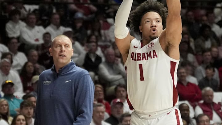 Feb 22, 2025; Tuscaloosa, AL, USA; Alabama guard Mark Sears (1) shoots a three poitner in front of Kentucky head coach Mark Pope at Coleman Coliseum. Mandatory Credit: Gary Cosby Jr. USA TODAY Network via IMAGN IMAGES