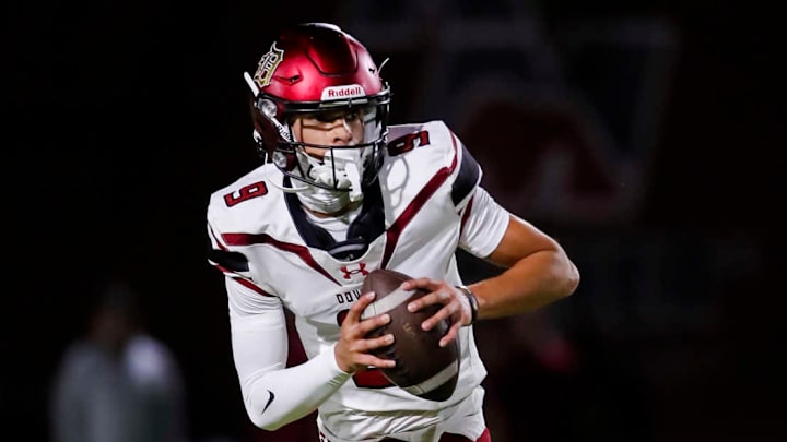 Oscar Rios of Downey High scrambles against Red Mountain (AZ).