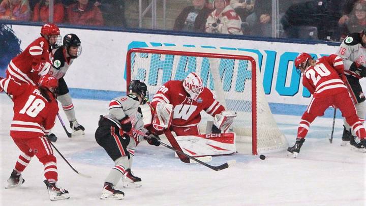 Wisconsin goaltender Ava McNaughton and Vivian Jungels (20) attempt to control the puck after an Ohio State shot during the Badgers' 3-2 victory over Ohio State in the national championship game at Pegula Ice Arena in University Park, Pa. on Sunday March 22, 2026. Wisconsin goaltender Ava McNaughton and Vivian Jungels (20) attempt to control the puck after an Ohio State shot during the Badgers' 3-2 victory over Ohio State in the national championship game at Pegula Ice Arena in University Park, Pa. on Sunday March 22, 2026.
