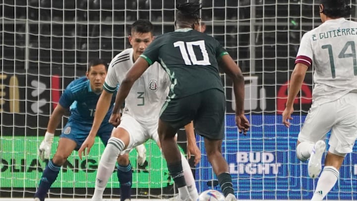 May 28, 2022; Arlington, TX, USA; Nigeria midfielder Joe Aribo (10) controls the ball against Mexico defender Cesar Jason Montes Castro (3) during the second half at AT&T Stadium. Mandatory Credit: Chris Jones-Imagn Images May 28, 2022; Arlington, TX, USA; Nigeria midfielder Joe Aribo (10) controls the ball against Mexico defender Cesar Jason Montes Castro (3) during the second half at AT&T Stadium. Mandatory Credit: Chris Jones-Imagn Images