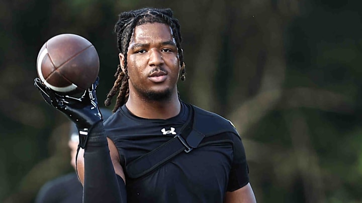 Anderson linebacker Antwoine Higgins prepares for the football game.
